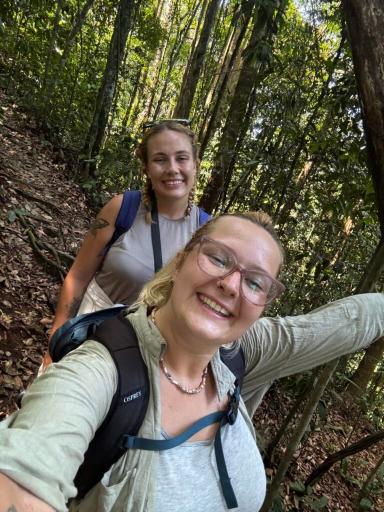two girls trekking in the jungle sumatra
