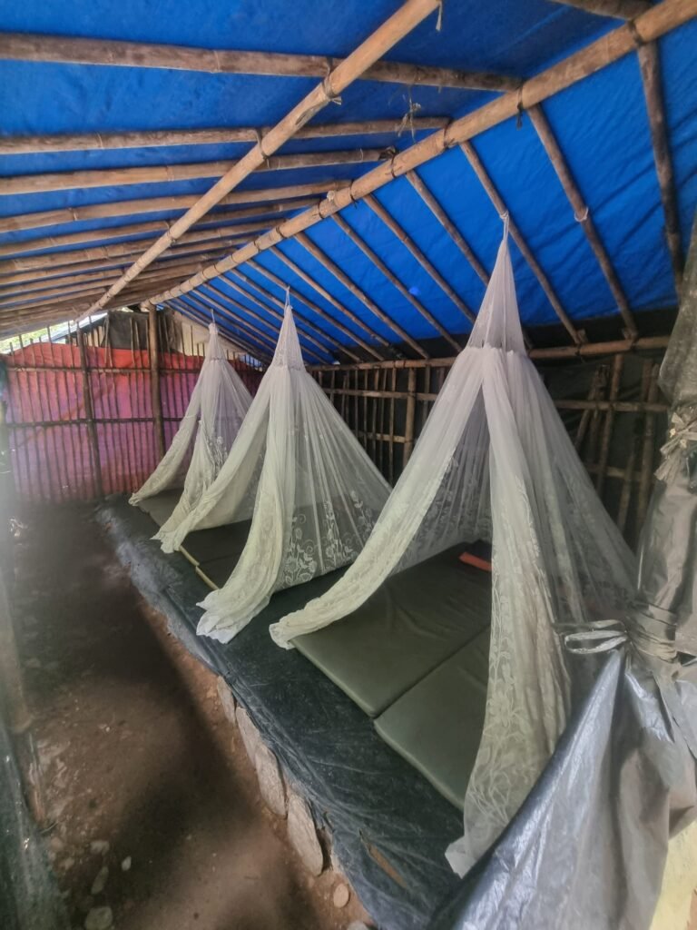 Riverside jungle campsite in Gunung Leuser National Park during a 2-day Bukit Lawang trek.
