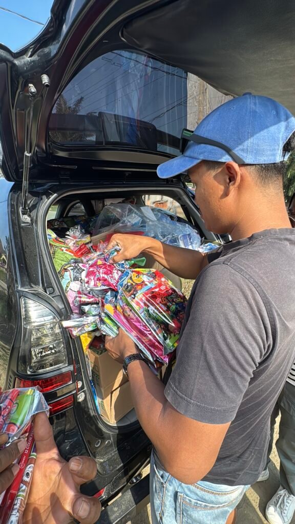 car with donations for local schools in aceh 