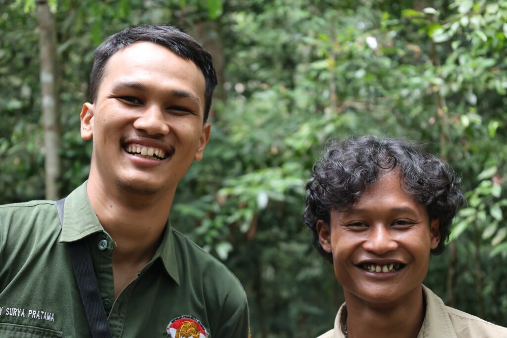 Certified HPI trekking guide leading a small group through the Sumatra rainforest.